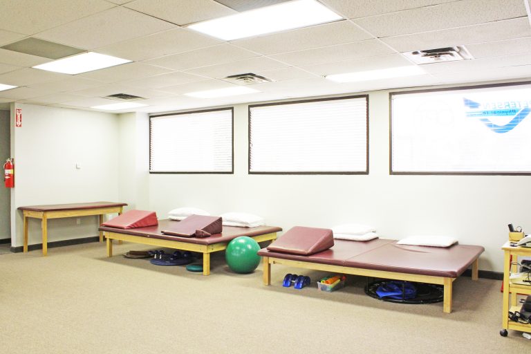 Some of the beds and equipment used by physical therapists in the Mesa office.