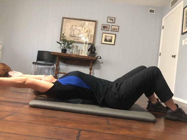 Ending position for supine thoracic spine mobilizations.