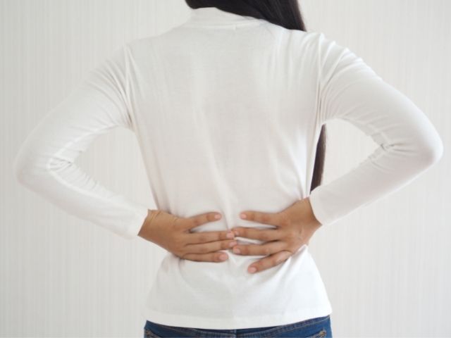 A woman with back pain from piriformis syndrome.