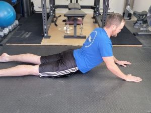 A physical therapist performing a herniated disc exercise.