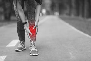 A runner experiencing the symptoms of shin splints.