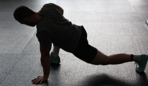 A man working on his mobility and flexibility in the gym.