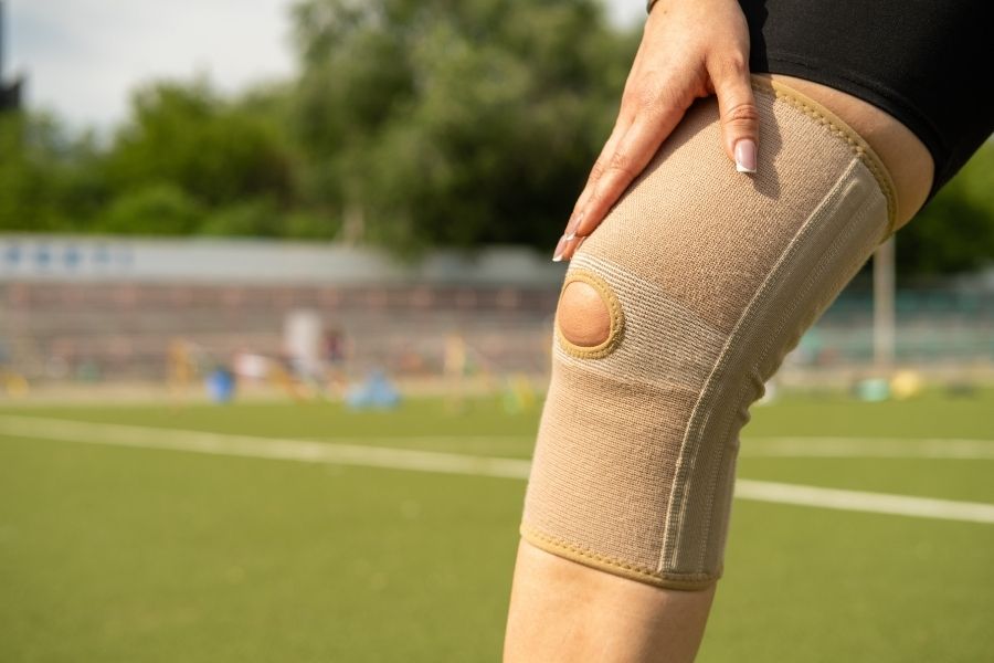 A woman working the stability in her knee joint.