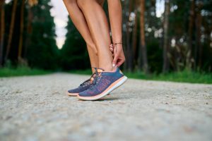 A woman with an Achilles tendon injury.