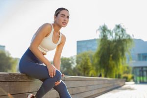 A woman with knee pain.